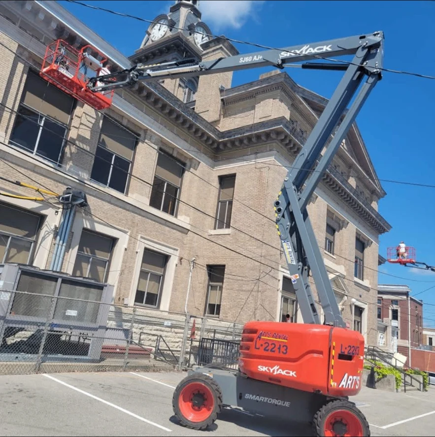 Chace Painting crew working from lifts on a large historic building